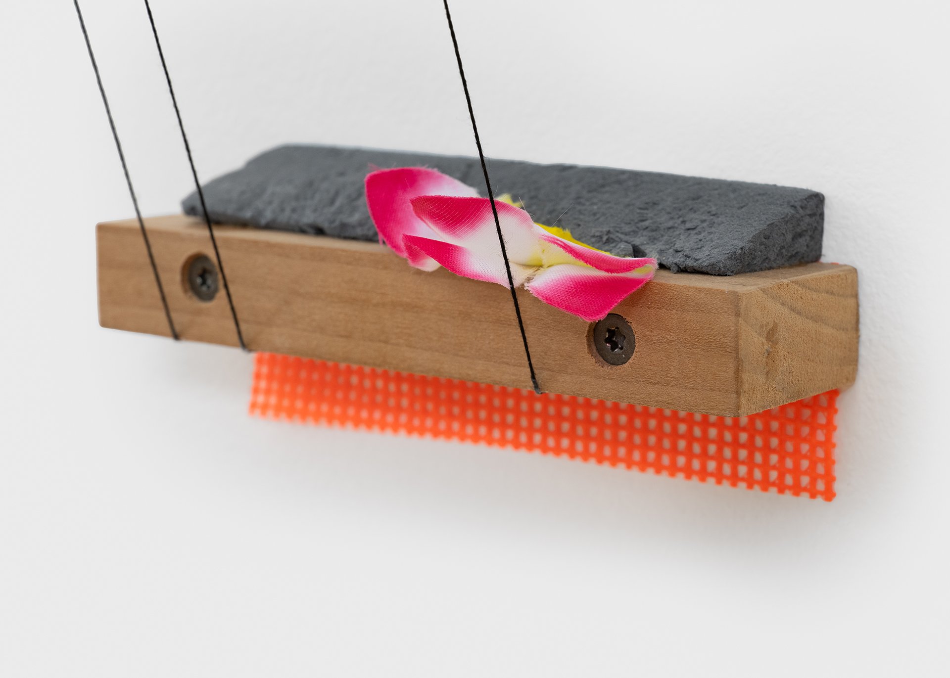    Castor and Pollux  , 2025 (detail) Baltic birch plywood, rigid foam insulation, drywall, string, hardwood, fabric mesh, artificial flowers, vinyl lettering 10.5”h x 5.5”w x 3.5”d 