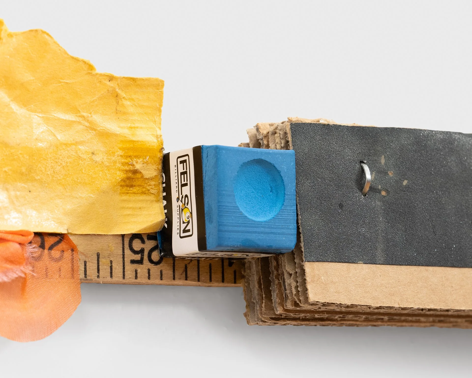    Landscape (Return)  , 2024 (detail) yardstick, abraded sandpaper, cyanotype on fabric, wire, cardboard, silk, manila envelope, graphite, cue chalk 7”h x 36”w x 1”d 