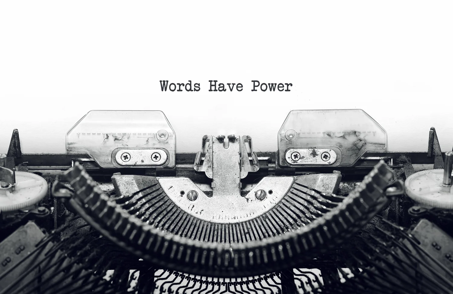 Typewriter keys with the phrase Words Have Power, matching the Be Amazing Paper Company homepage style