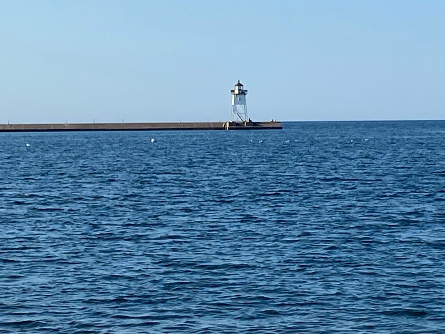 Harbor Watch: the light house also watches over the years and decades of the harbor. It also shines light in dark times.