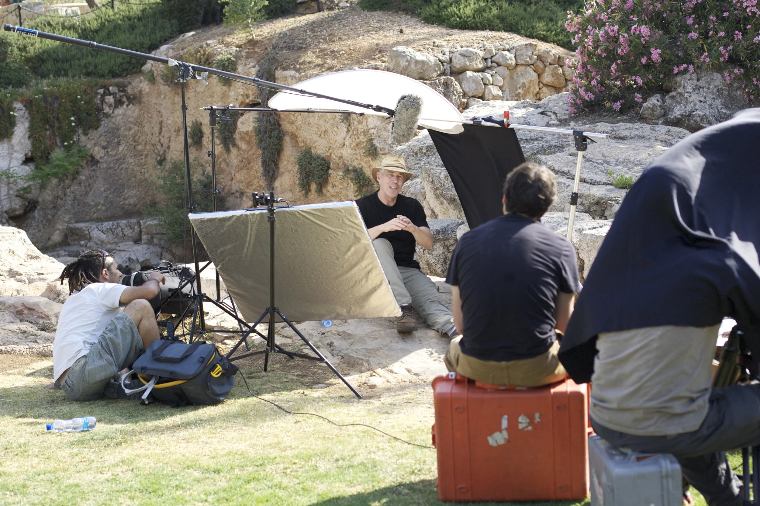 Steve Hoggard interviews archeologist Byron McCane outside a burial tomb in Jerusalem.