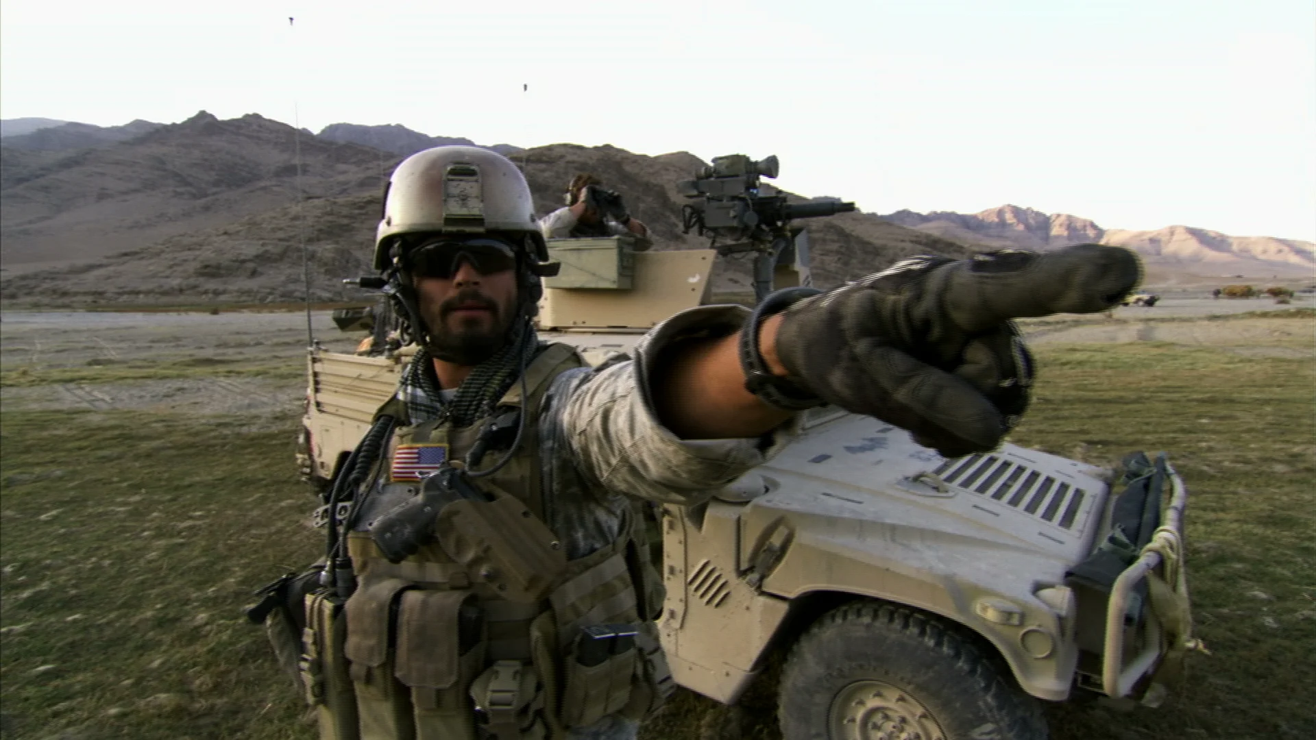 Green Beret Captain 'Rob' directs the Hoggard camera crew to follow two men into the suspected Taliban compound.