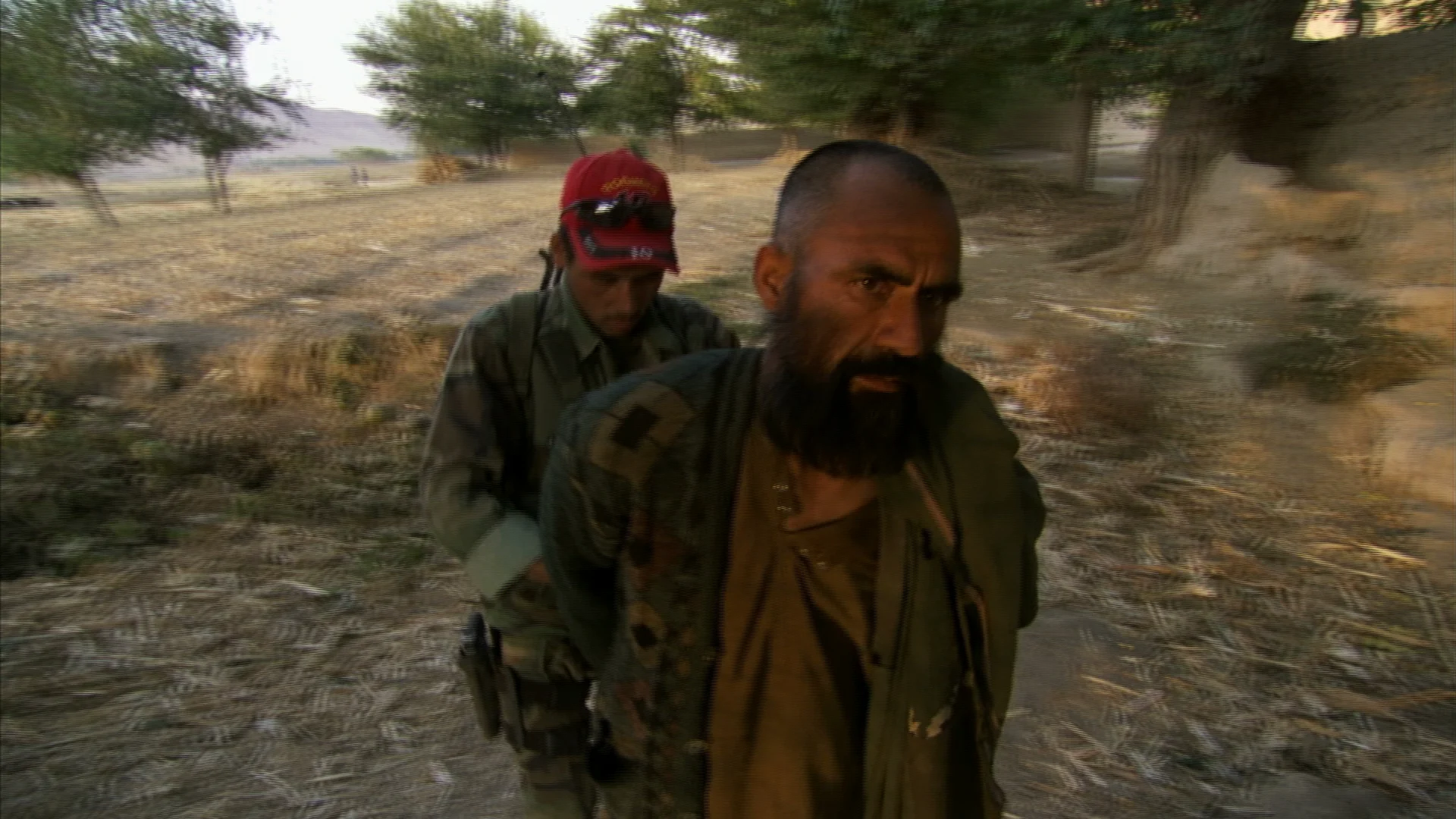 Six hours from base, the Green Berets take this suspected Taliban spotter into custody.