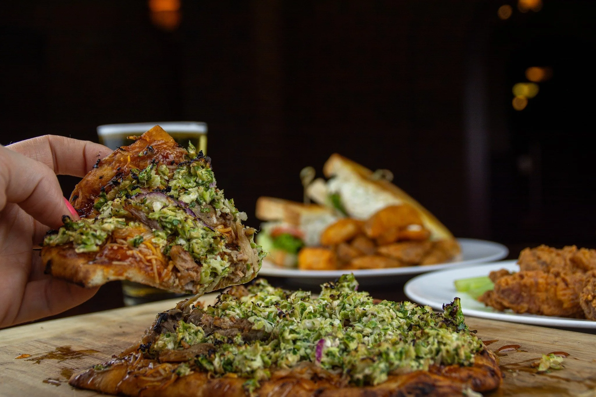 Meet the Carolina Flatbread - loaded with pulled pork, cheddar, caramelized onions, Brussels sprout slaw, Crown Royal Peach BBQ sauce, and a drizzle of hot honey. Part of our Pork Stars lineup and a great way earn a chance to win big in our giveaway!