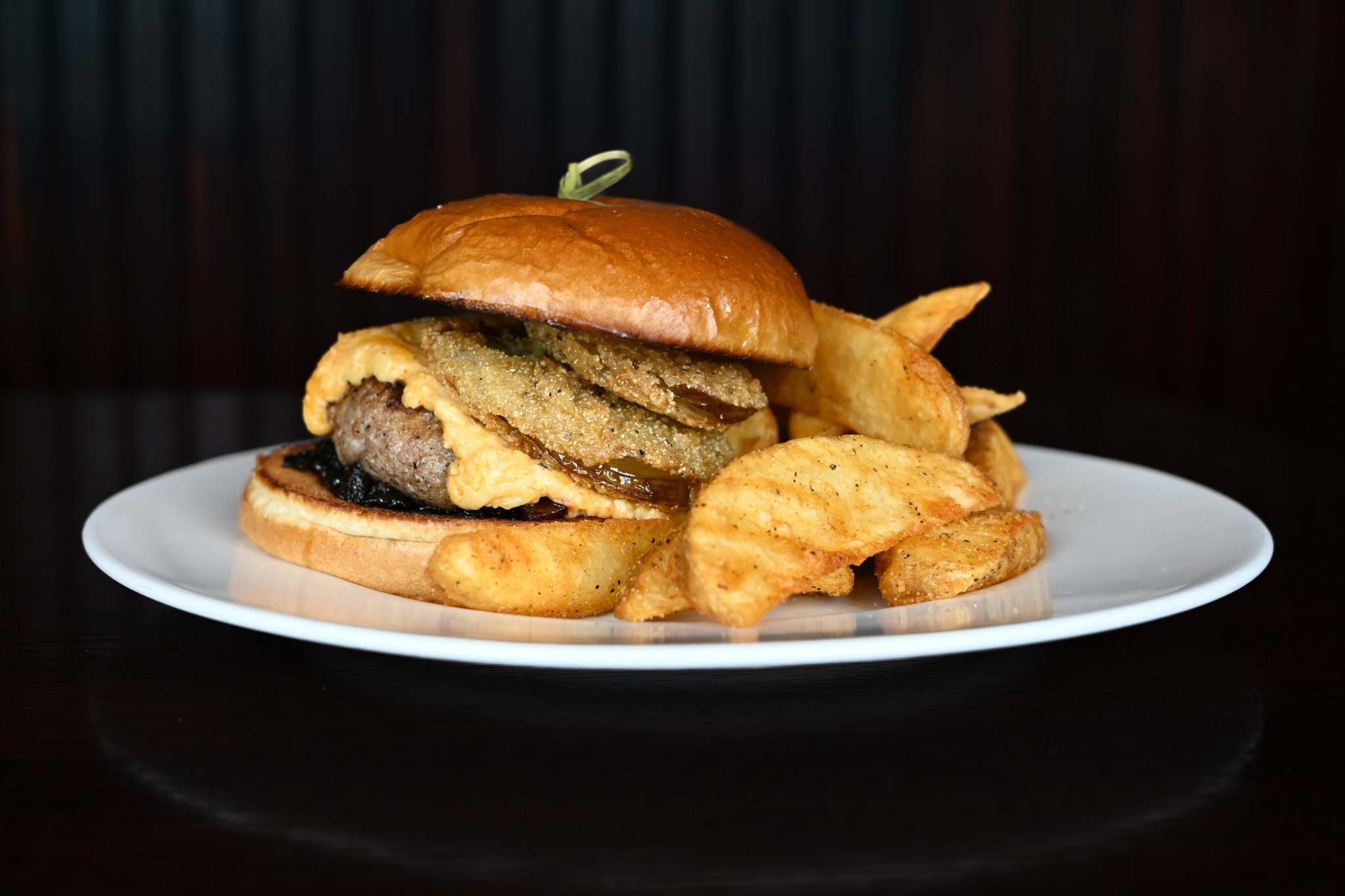 Now this is how you build a burger. 🐷🍔

The Southern-Style Boar Burger starts with a custom blend of premium pork loin and smoked pork belly, then gets topped with smoky bacon jam, creamy pimento cheese, and a crispy fried green tomato before being