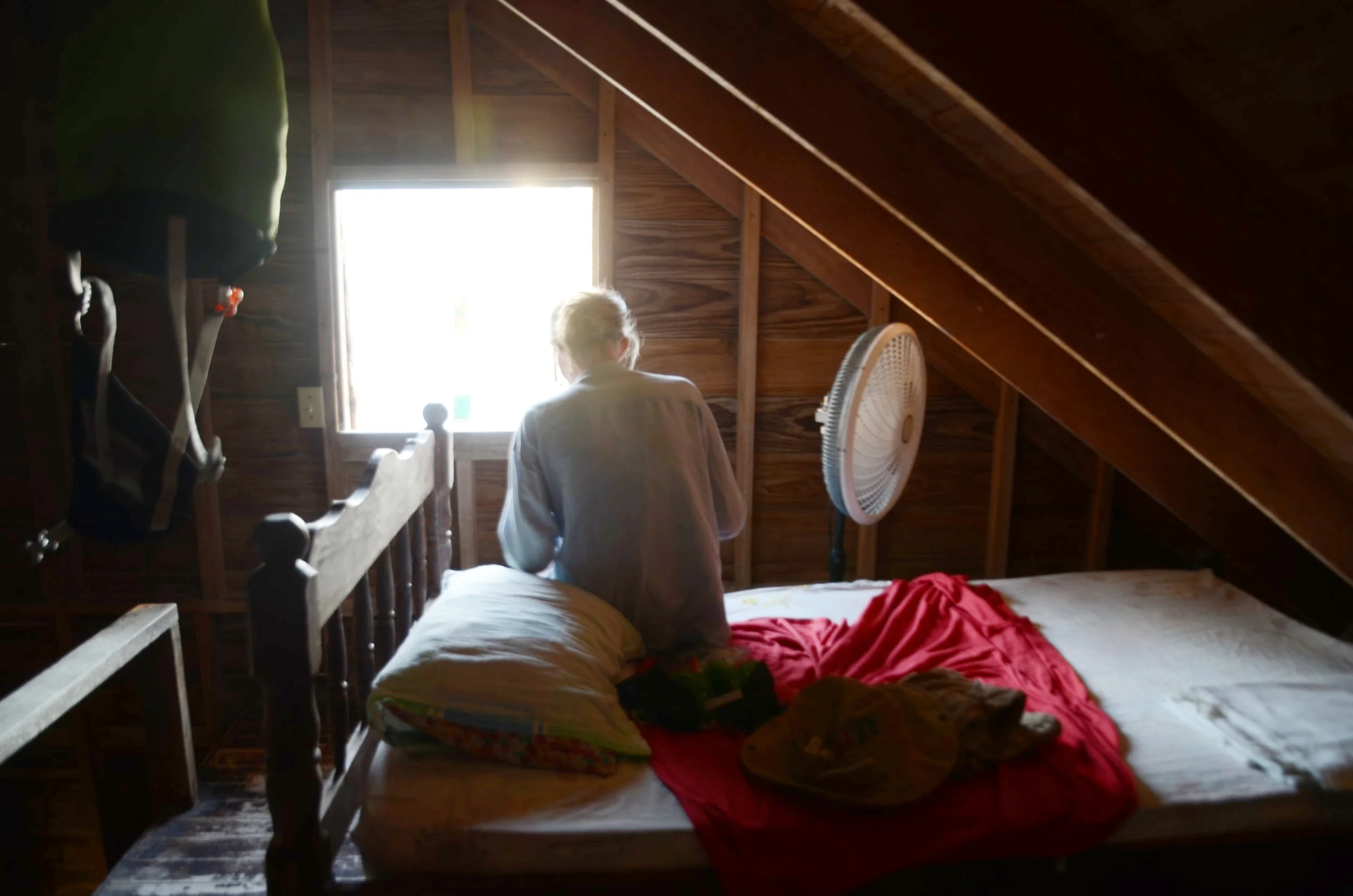 Allie snacking on some oranges at our hostel on Caye Caulker in Belize. $10 per night.