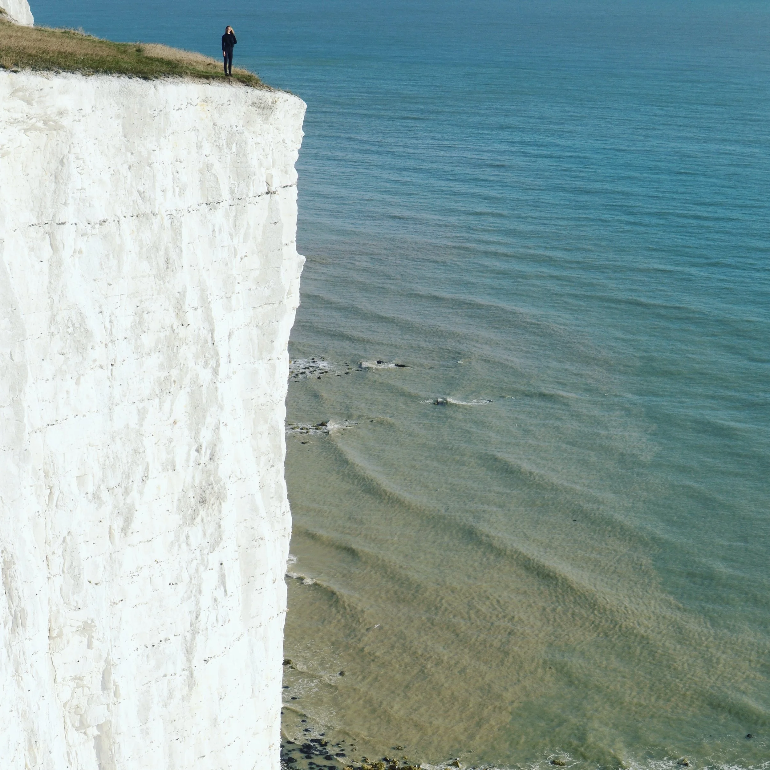 Allie standing at the edge of the White Cliffs of Dover.