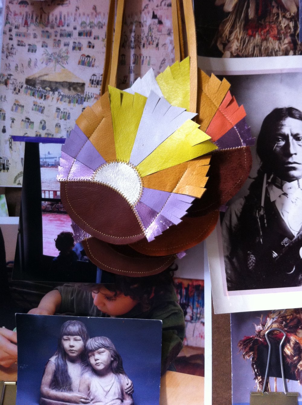 Pouches from Kristen's line, Manimal over her inspiration board. 