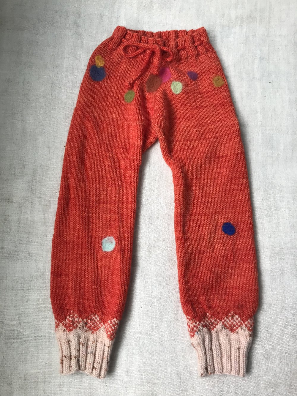Pinecone leggings + colorful felting to cover holes