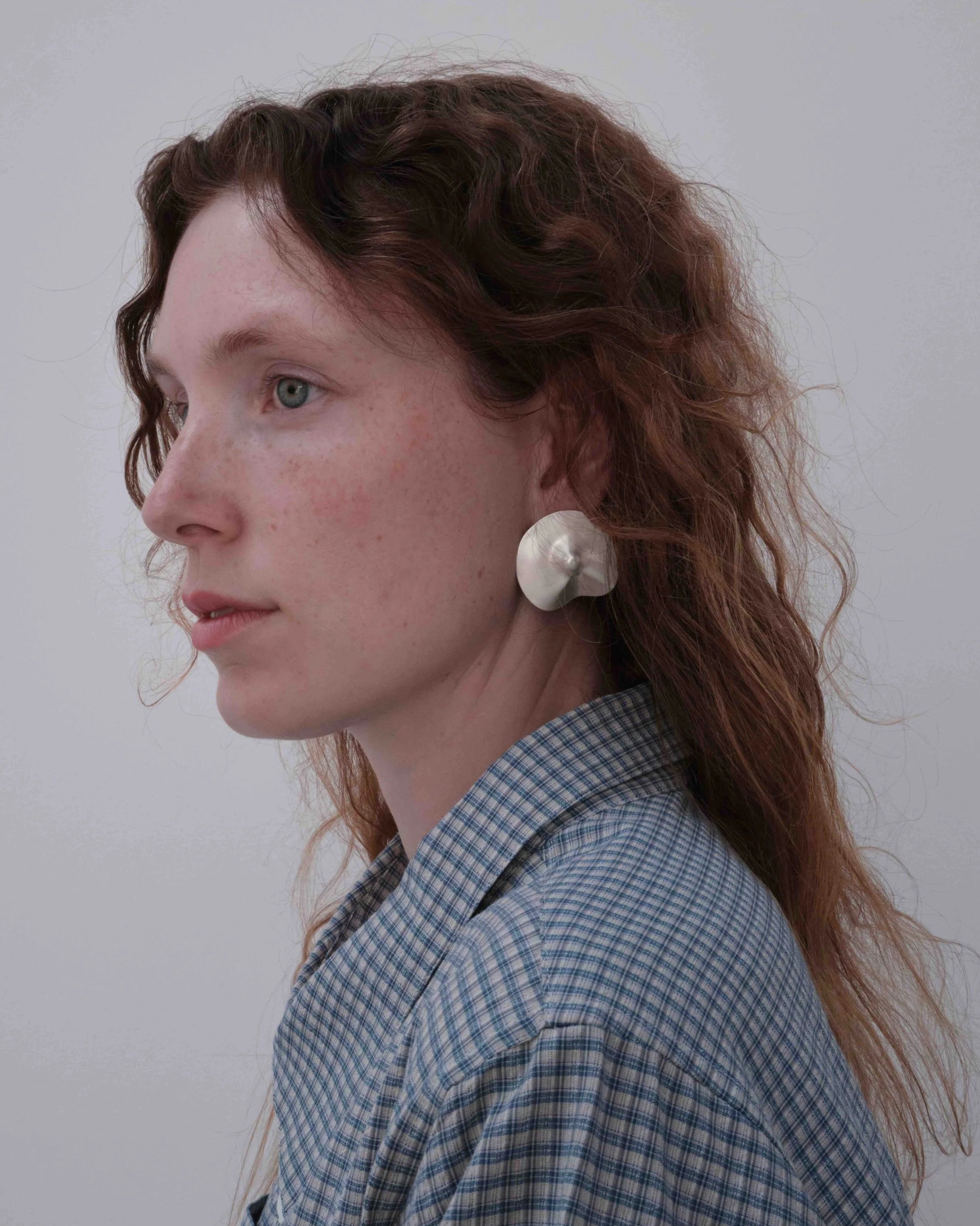 jakhu-llutu-silver-earrings-small-on-model-2.jpg