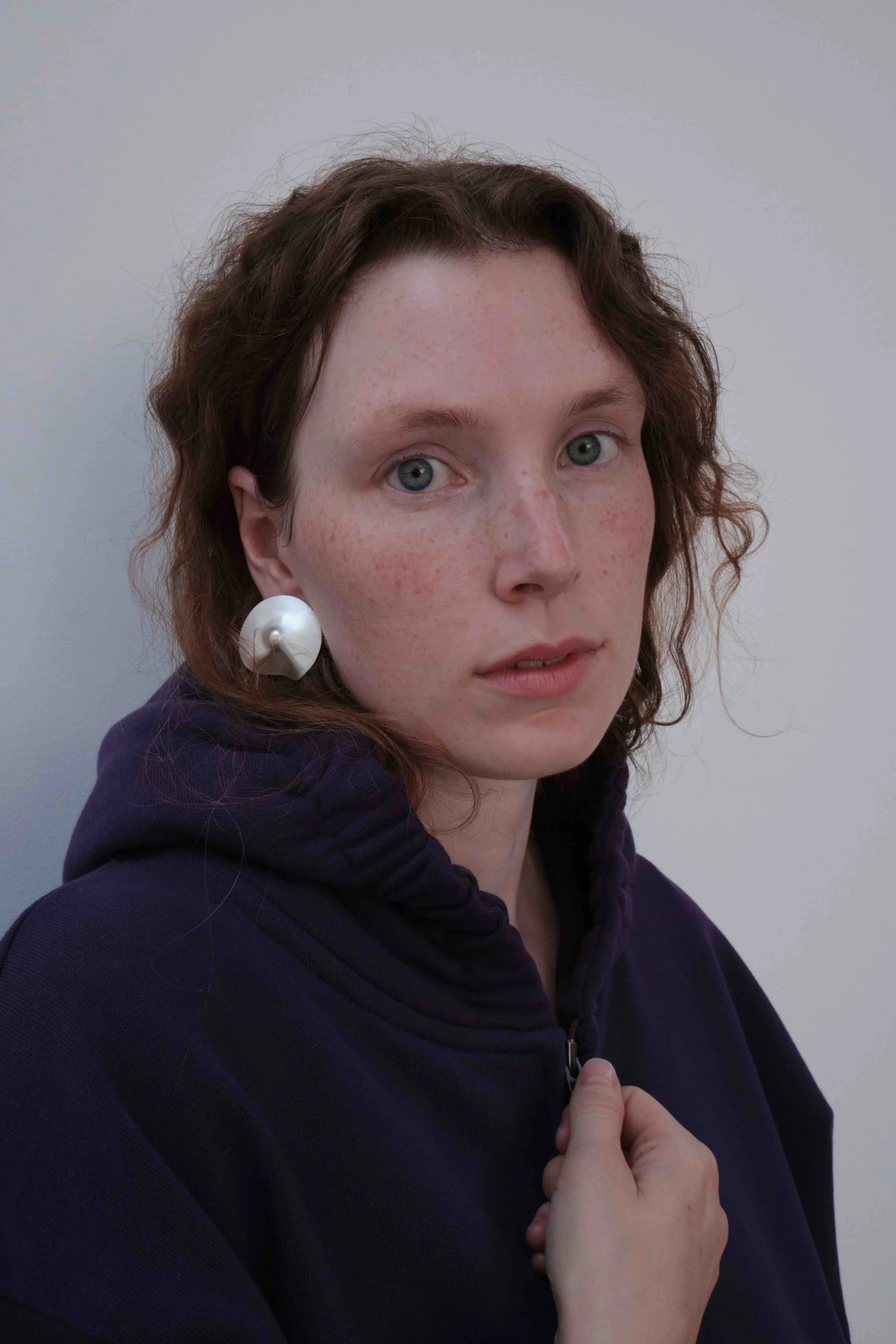 jakhu-llutu-silver-earrings-small-on-model.jpeg