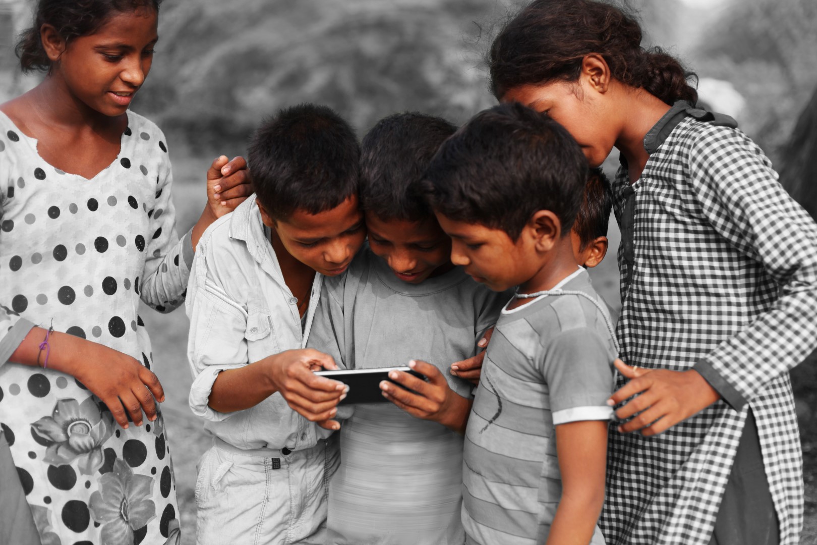 Group-of-children-using-smart-phone.jpeg