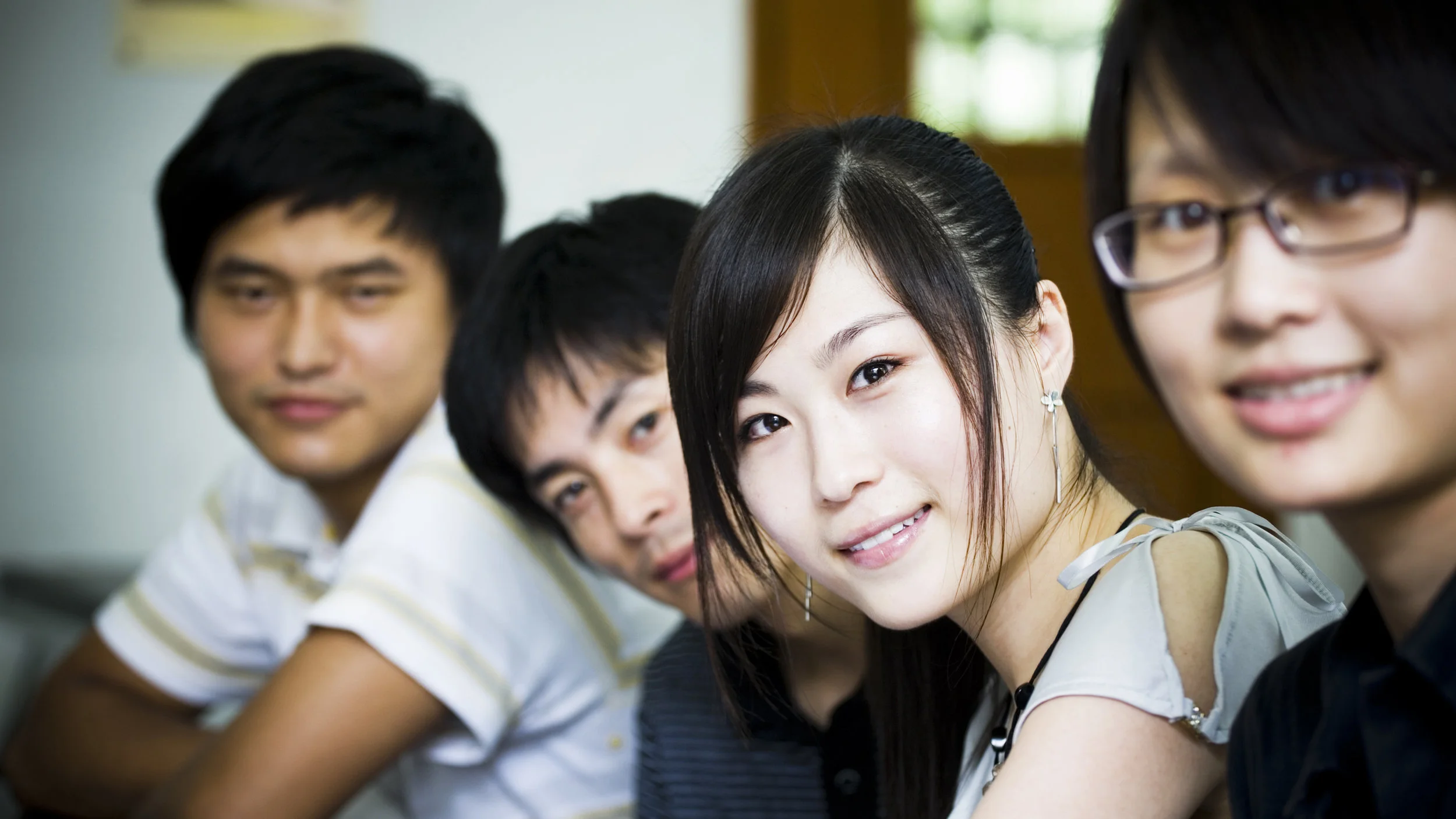 Group-of-young-Asian-people-smiling-113711018_3008x1692.jpeg
