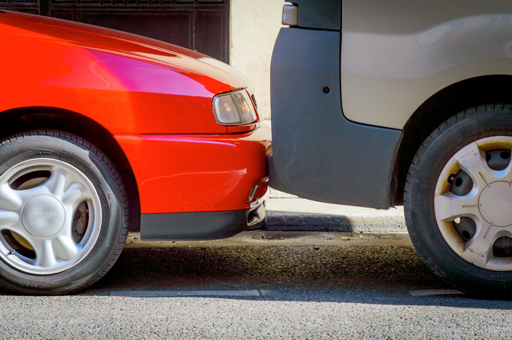 Cars are parked in the parking lot very tightly to each other.jpg