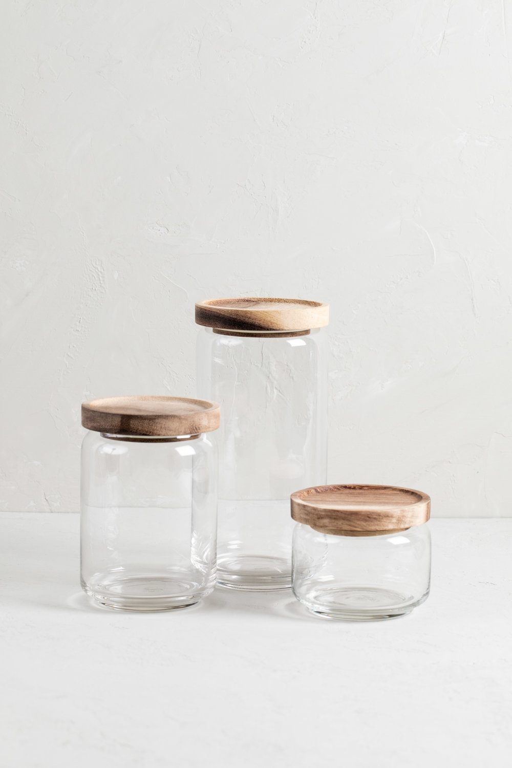 https://images.squarespace-cdn.com/content/v1/591e25c715cf7d0ce88d273e/1557862140937-2VJW26STPOSMT3J2JBZI/Glass+Containers+with+Acacia+Lid+%282+of+2%29.jpg?format=1000w