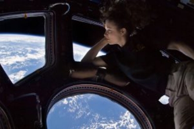 Astronaut Tracy Caldwell-Dyson looking back at the Earth from the International Space Station.