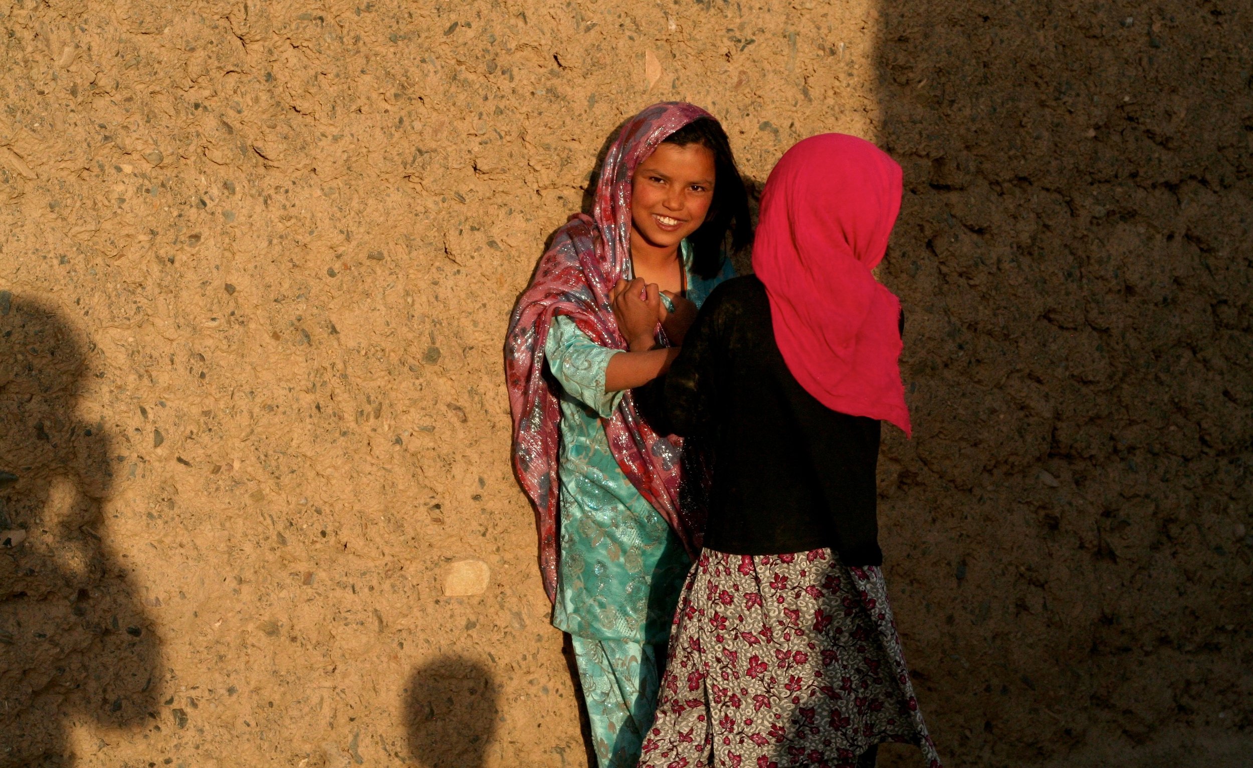 Afghanistan: girls, gaze, and the photog (in shadow). 