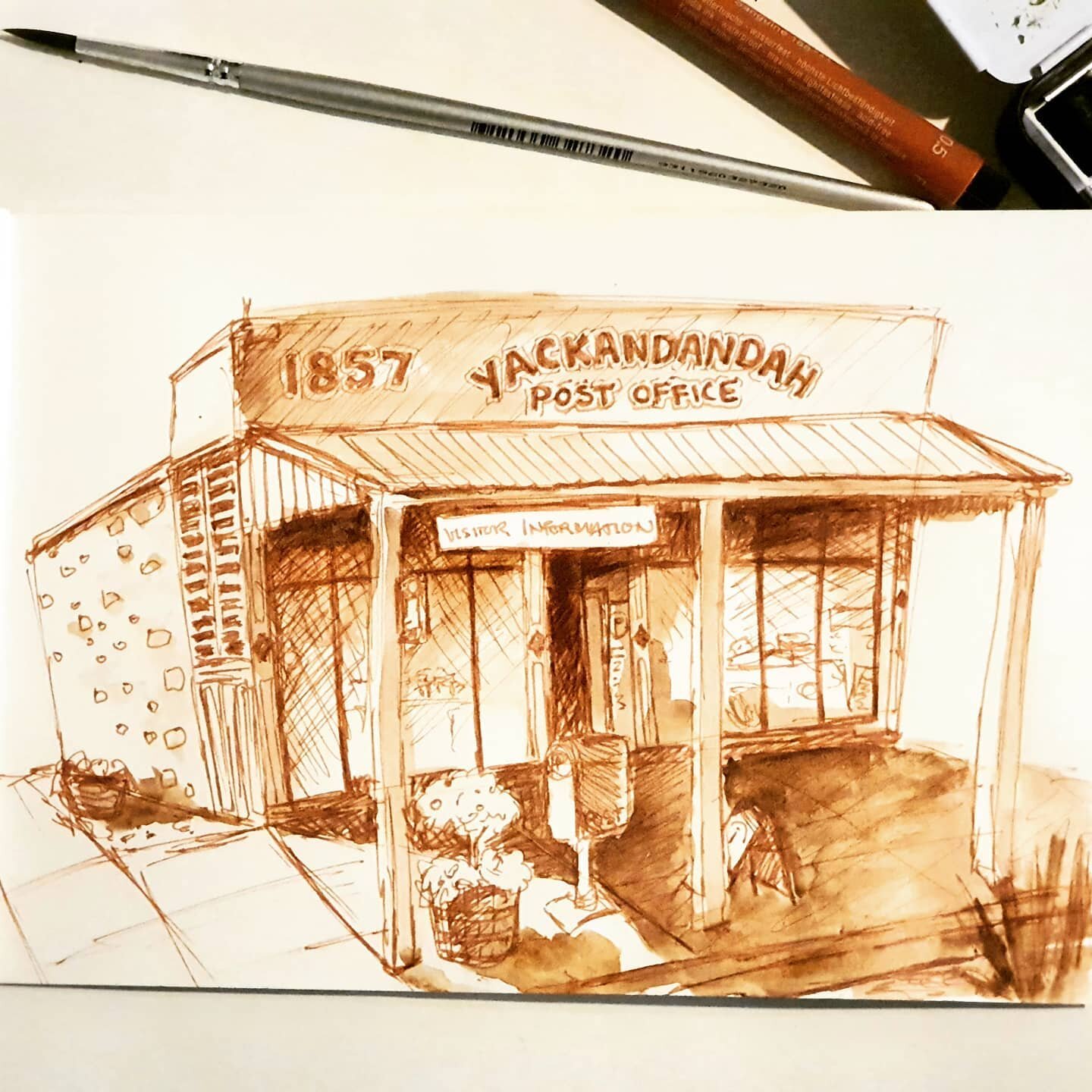 In my journal today; a quick &amp; loose sketch of the Yackandandah Post Office up the road. Fine liner and watercolour on rubbish paper. I might have to do a proper version; it's a beautiful building, especially the stonework down the side.

#yackan