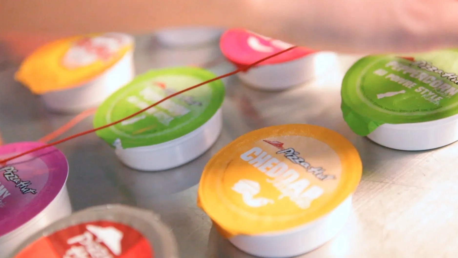 dip-hop-playing-music-by-dipping-pizza-slices-in-various-sauce-cups.jpg