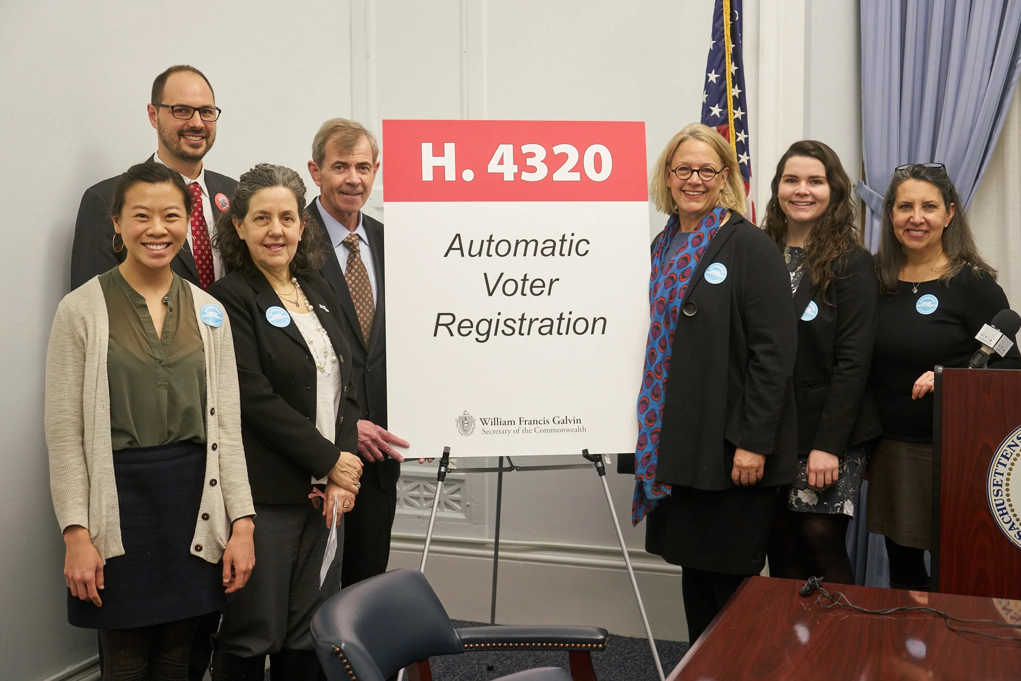 Secretary of State William F. Galvin with LEV founder Joyce Hackett (right of the sign) and members of the Election Modernization Coalition.