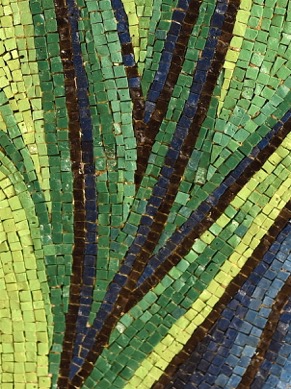 Note the inclusion of blue tesserae in the green