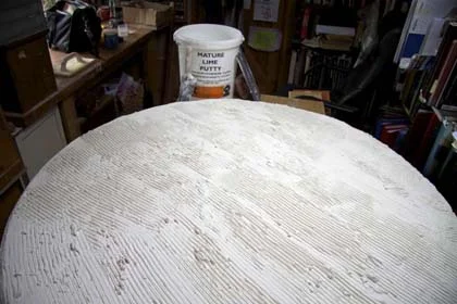 Lime putty spread to dry before setting mosaic tesserae