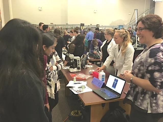 Mary Stewart (right), Director of Education & Workforce Development at ARMI | BioFabUSA, engages with students at "Girls in STEM"