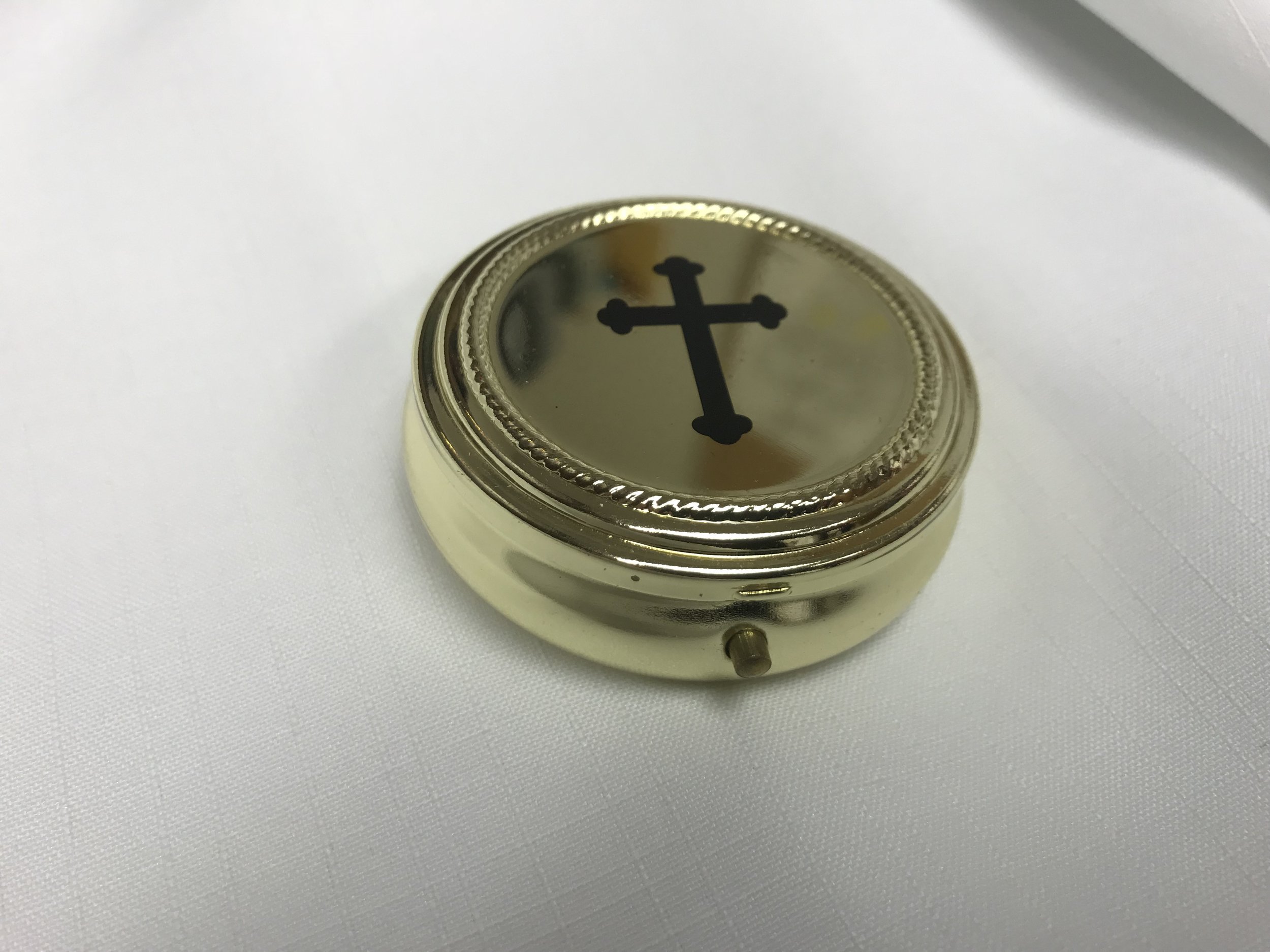 Open pyx that holds the Eucharist