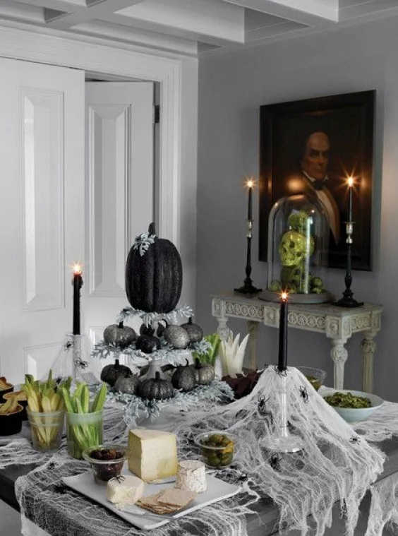 Elegant table setting with black pumpkins