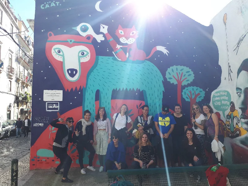 Getting to know the streets & art on a walking neighborhood visit.