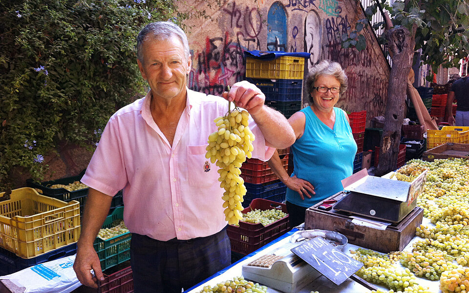 grape sellers at market in greece.jpg