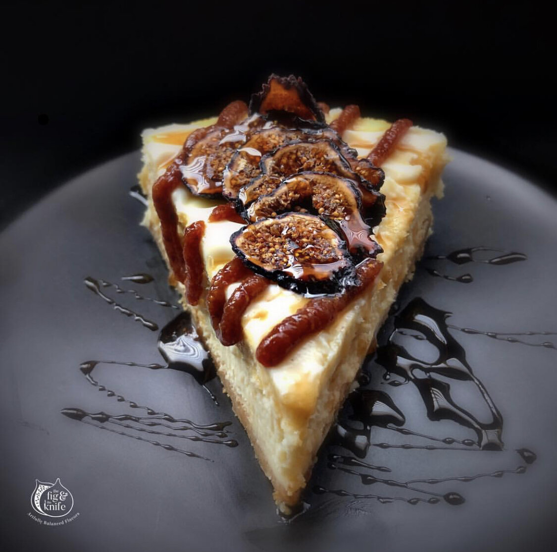  Cheesecake topped with a touch of white chocolate ganache, Fig &amp; Apricot Spread, dried figs and a local Arizona honey drizzle. 