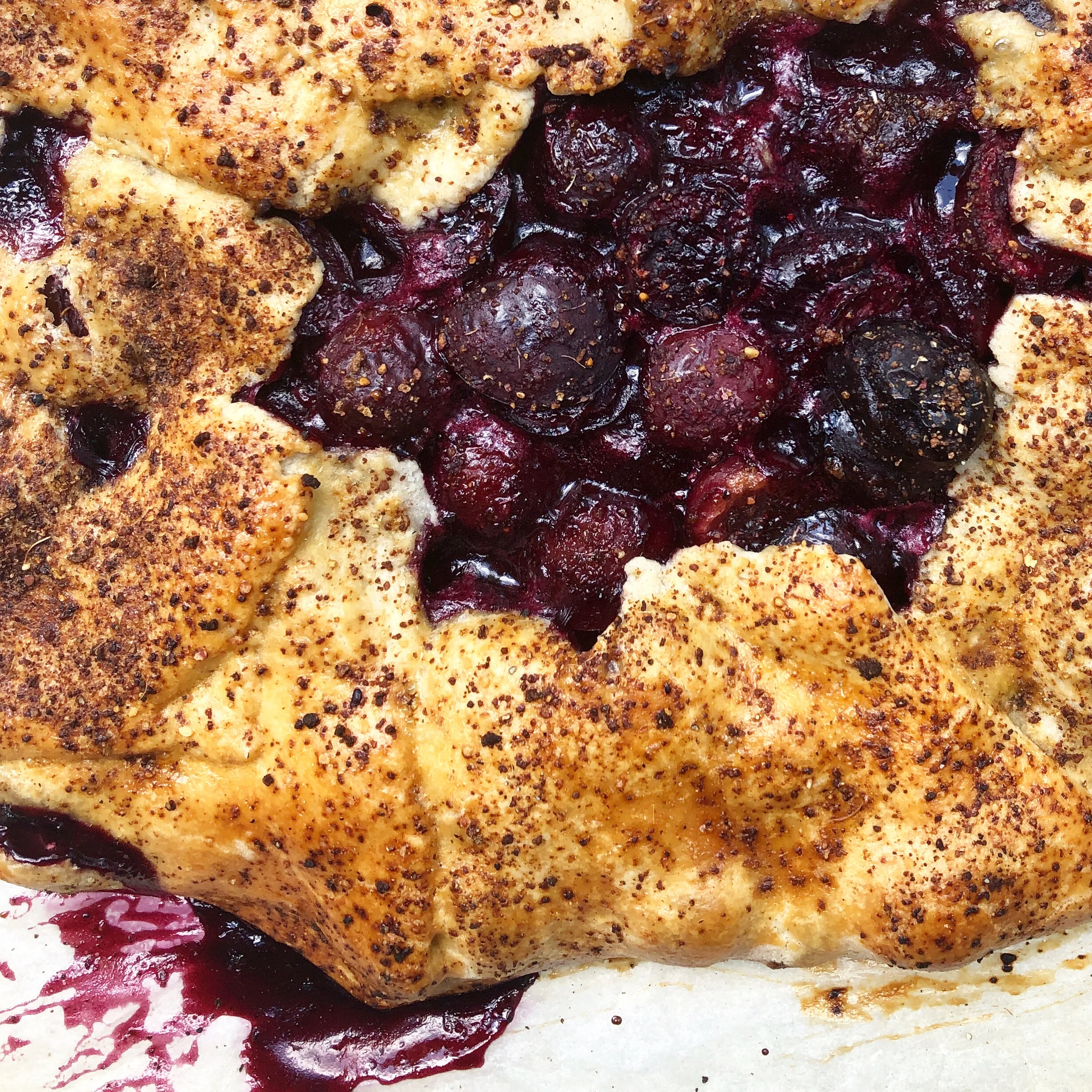 Fresh cherries get a sprinkling of Fairy Fig Dust in a rustic galette 