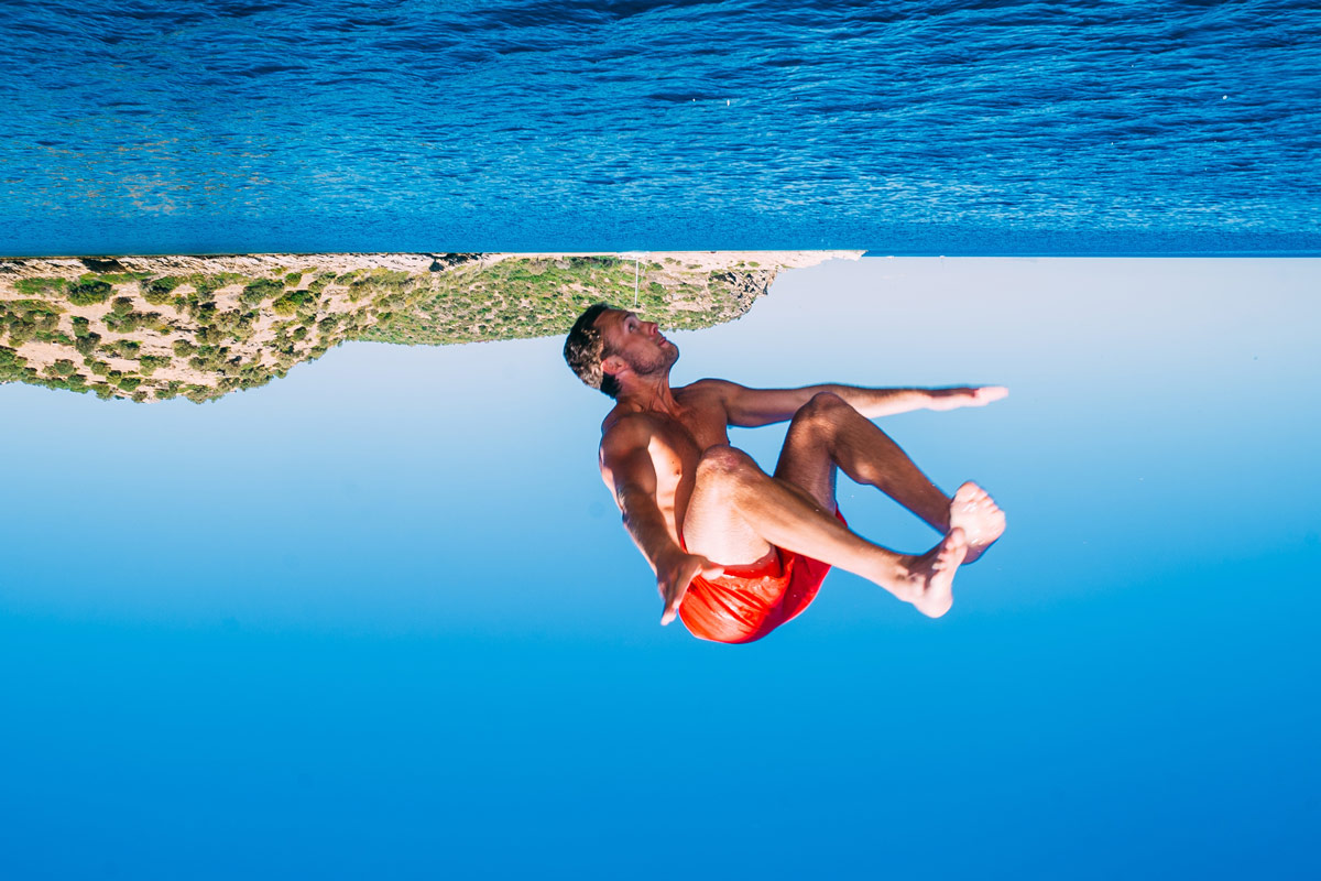 Man jumping into water because of how excited he is about interactive media and instagram ads (probably).
