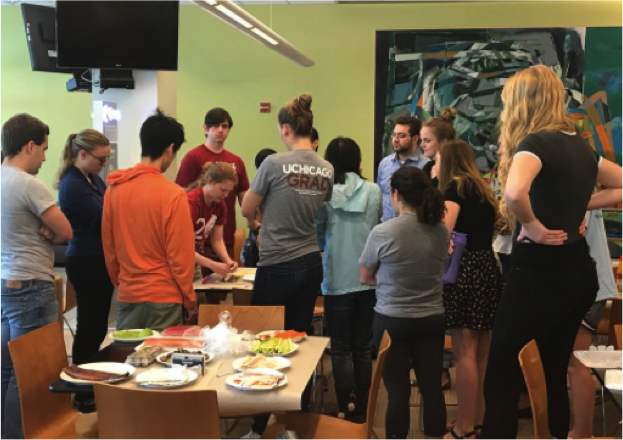 Students from Pritzker, Divinity, and Biological Sciences learn how to make sushi rolls