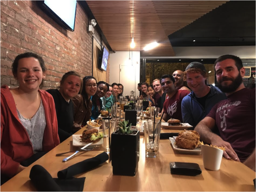 Students from Booth, Law, Physical Sciences, and Molecular Engineering enjoying burgers after an afternoon of rock climbing.