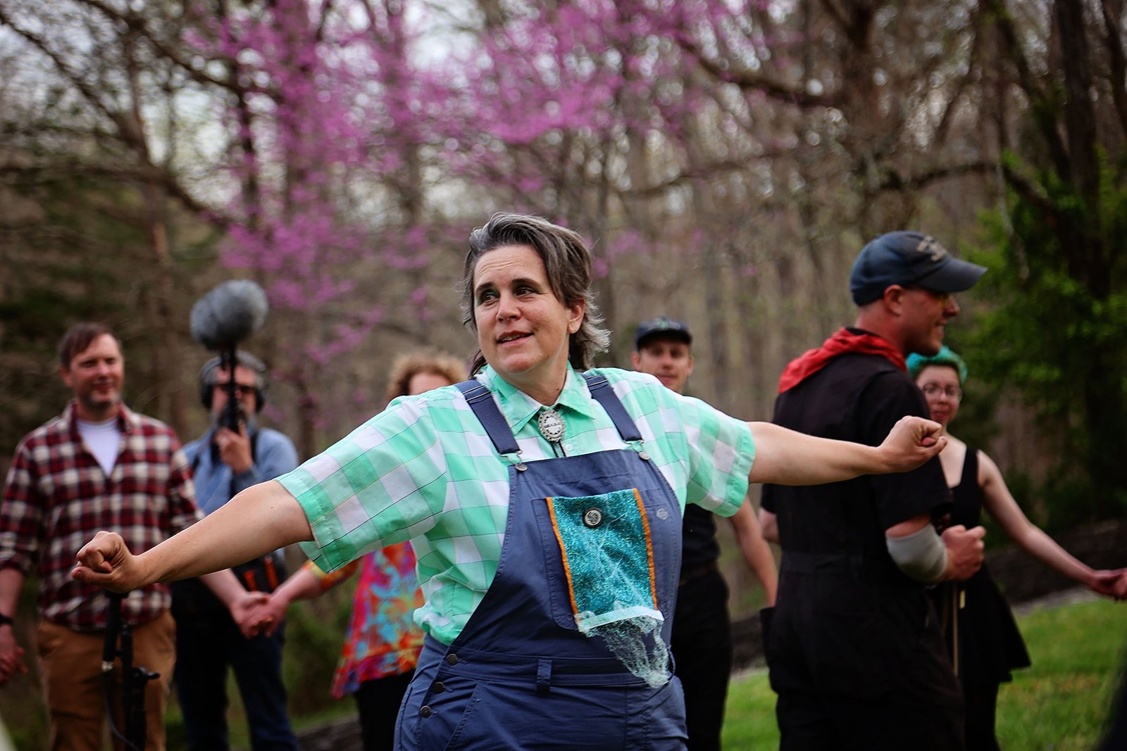  Nicole Garneau teaches the audience a song for Ezell: Ballad of a Land Man, March 2022, Berea College Forestry Center. Photo: Erica Chambers.  