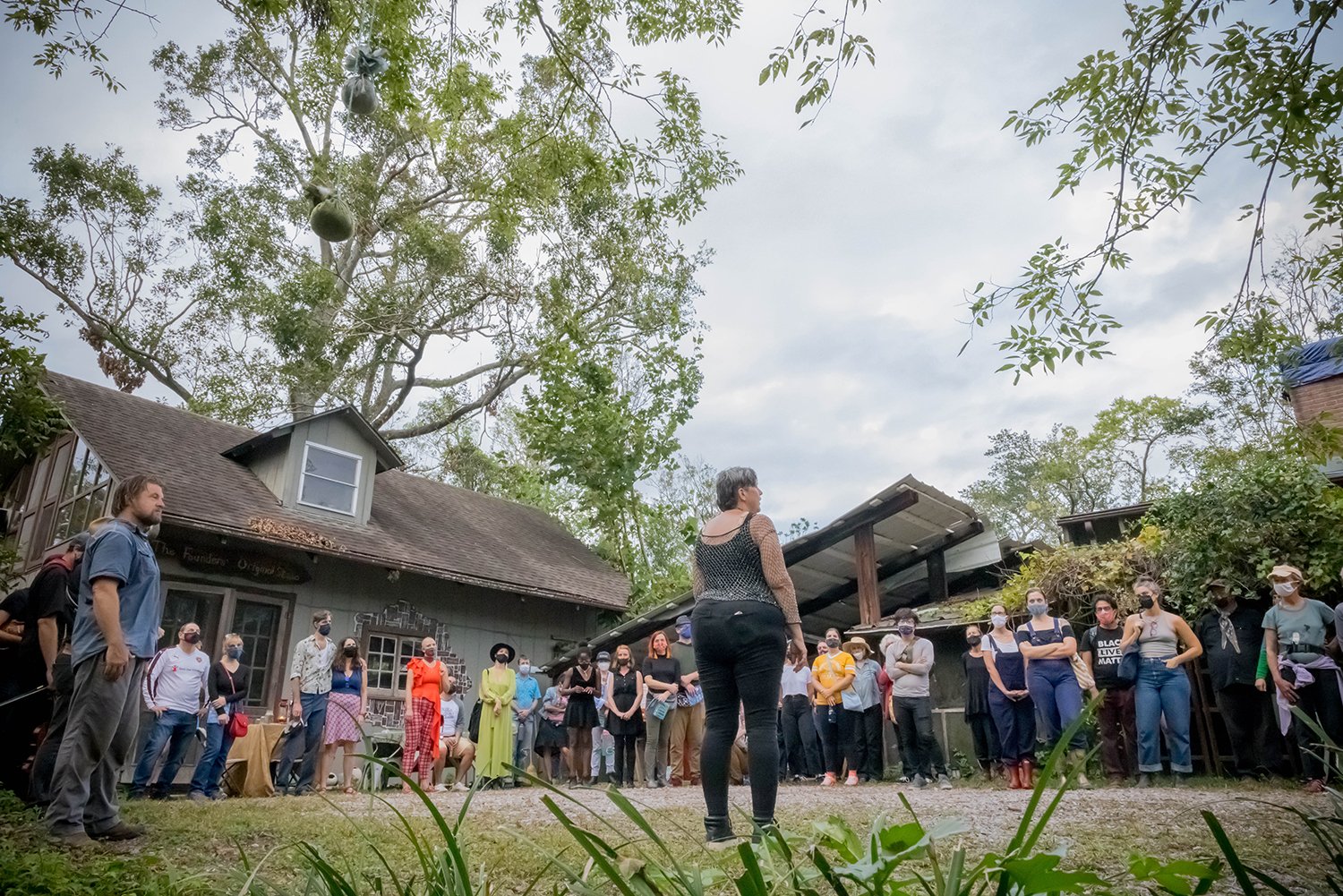  Nicole Garneau teaches the audience a song as part of Ezell: Ballad of a Land Man at Studio in the Woods, New Orleans, LA, October 2021. Photo: Melisa Cardona.  