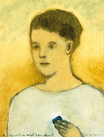 "A boy with a small blue object"