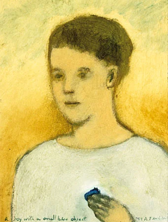 Boy with a small blue object