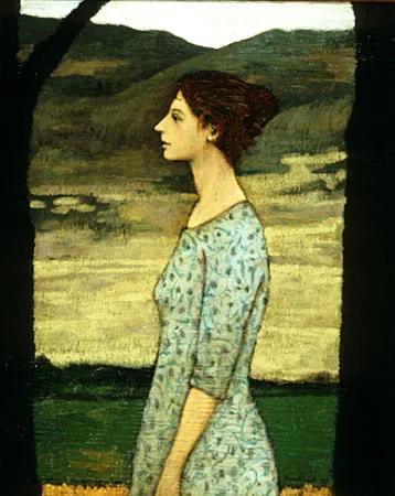 A woman in the space between trees