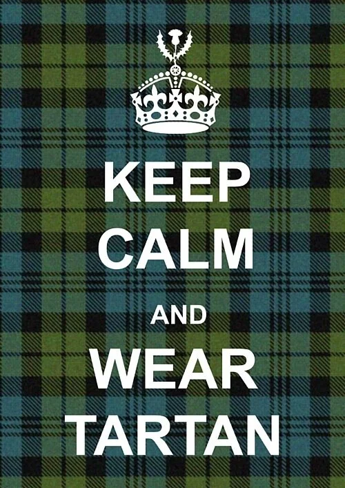 wearing a tartan sweatshirt