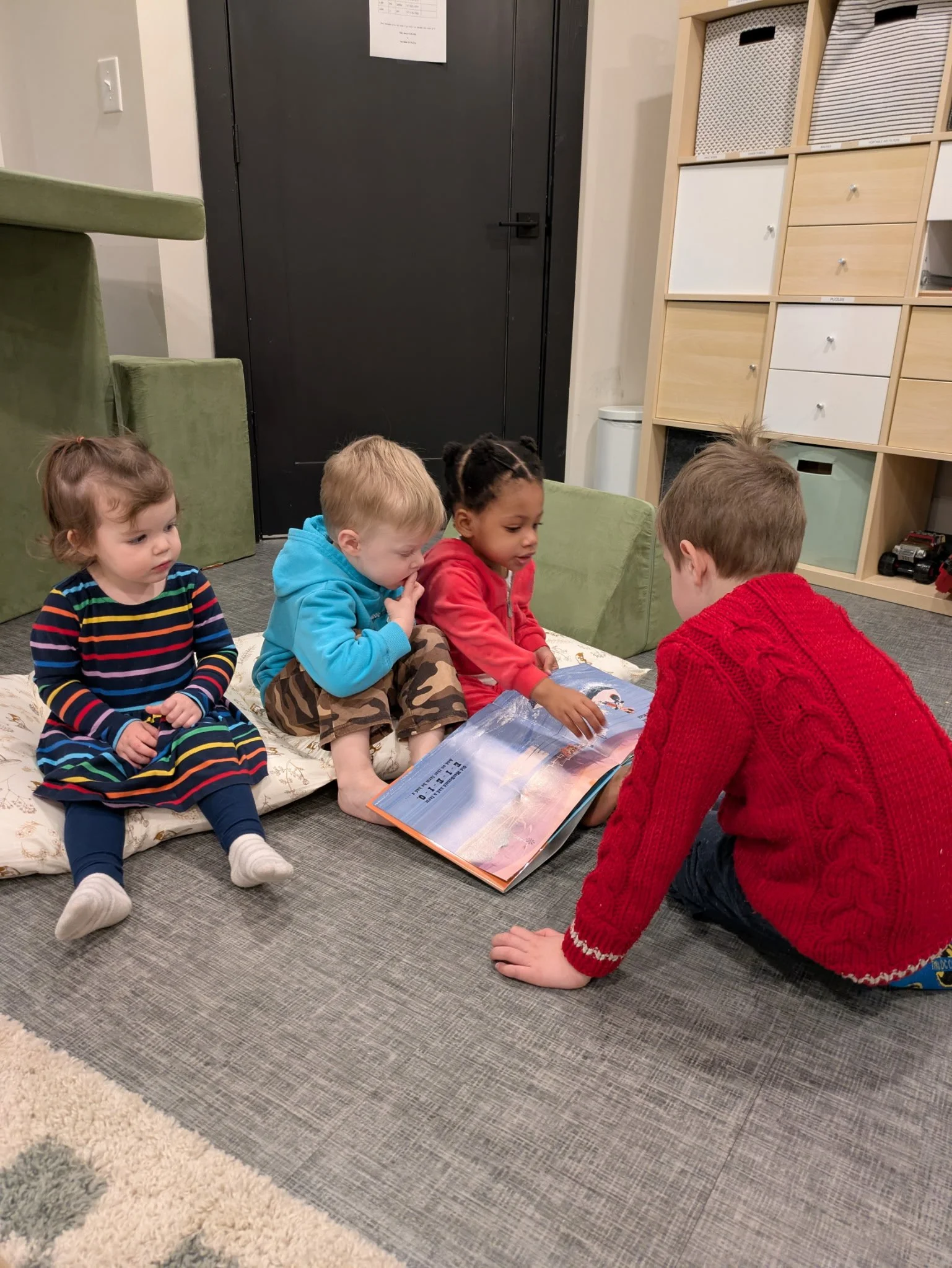 Kinley reading to everyone.jpeg