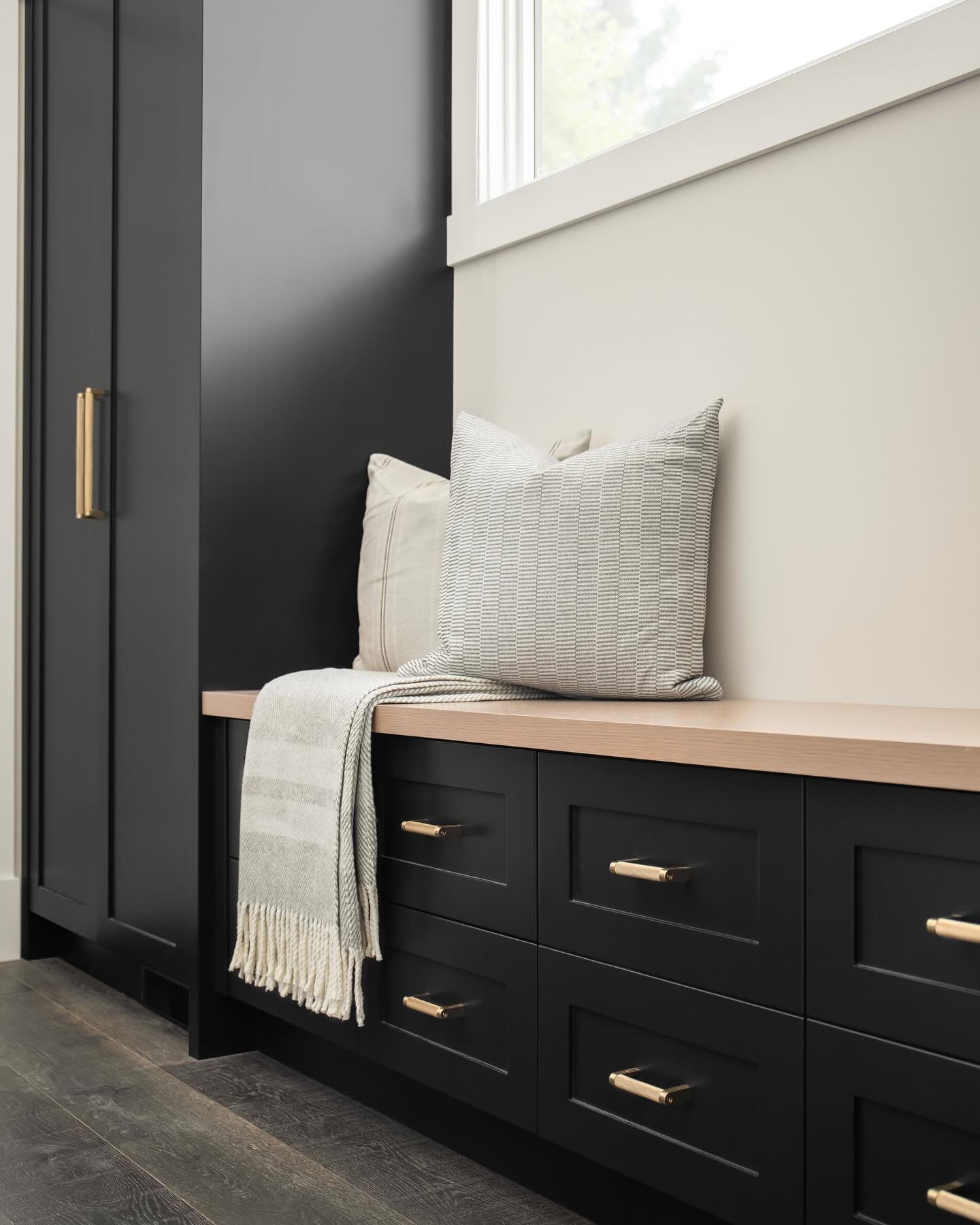 More from our Lake Tahoe project. Nothing better than a beautiful mudroom with tons of storage and functionality. The primary ensuite is bright and airy with all the natural light. The main bathroom is timeless with its black cabinetry. And then back