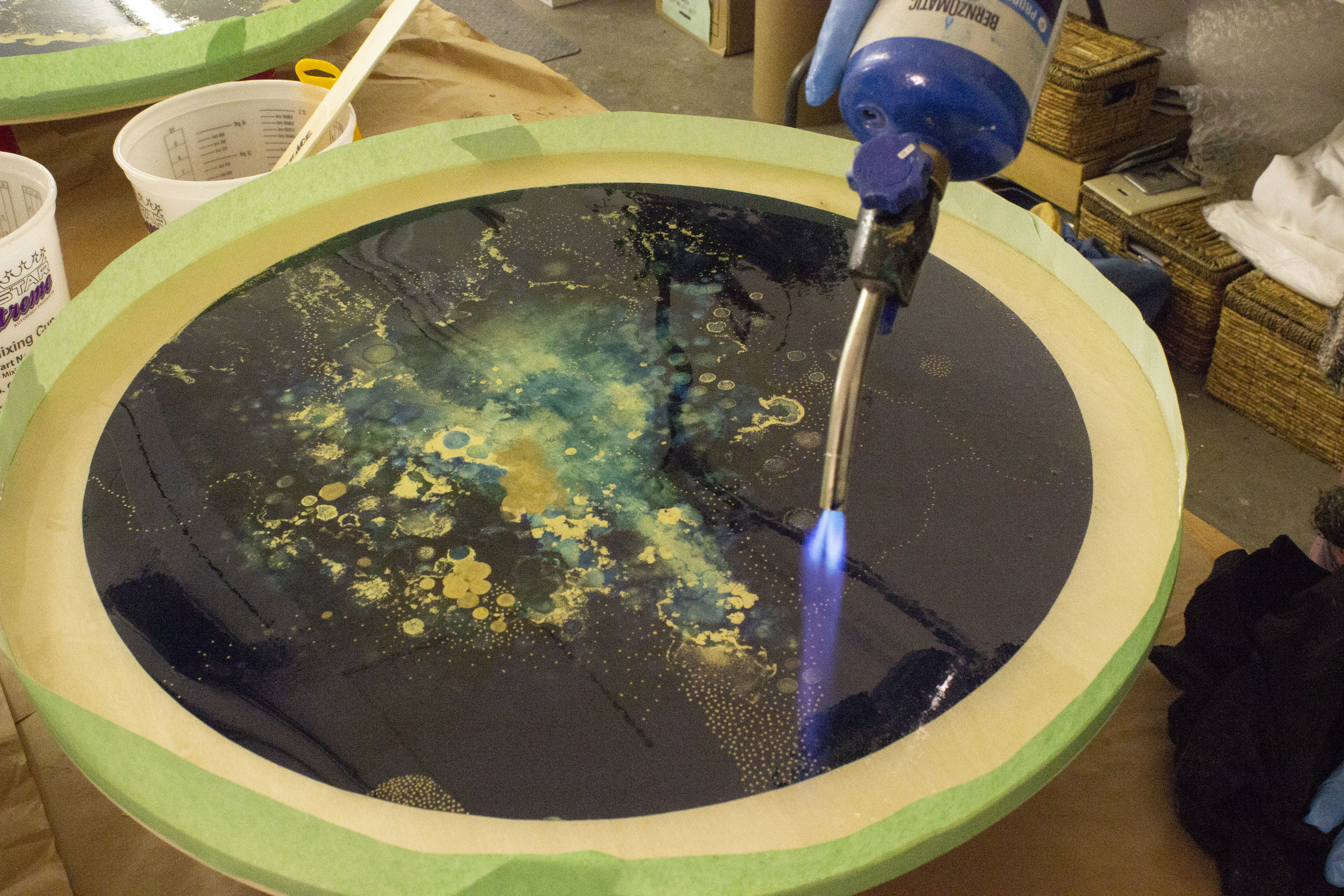 Curing resin with a torch.