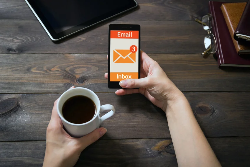 The woman received an e-mail online on a mobile phone. Message online icon.