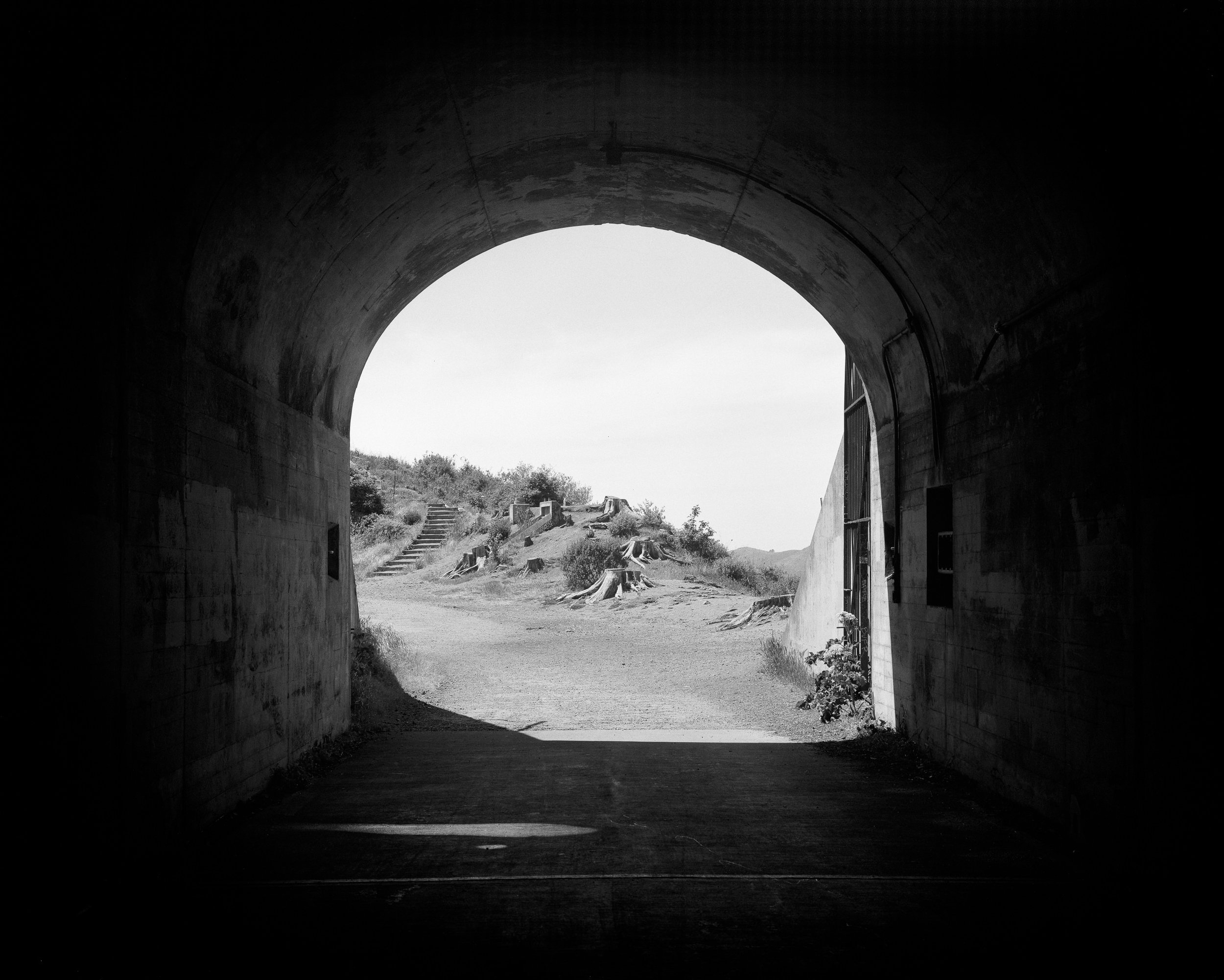 Barry and Cronkhite Hiking up slopes of the Marin Headlands with 15 lbs of camera gear, I recall the days I was drafted into the military. On beautiful rugged trails and remote locations, my comrades and I spend a mind-numbing amount of time training, route marching to nowhere in particular, waiting for a conflict that would never come. "Waiting to rush, and rushing to wait", we'd say. These images, made on a 4x5 film camera, and processed by hand, are an homage to those moments in my past life.