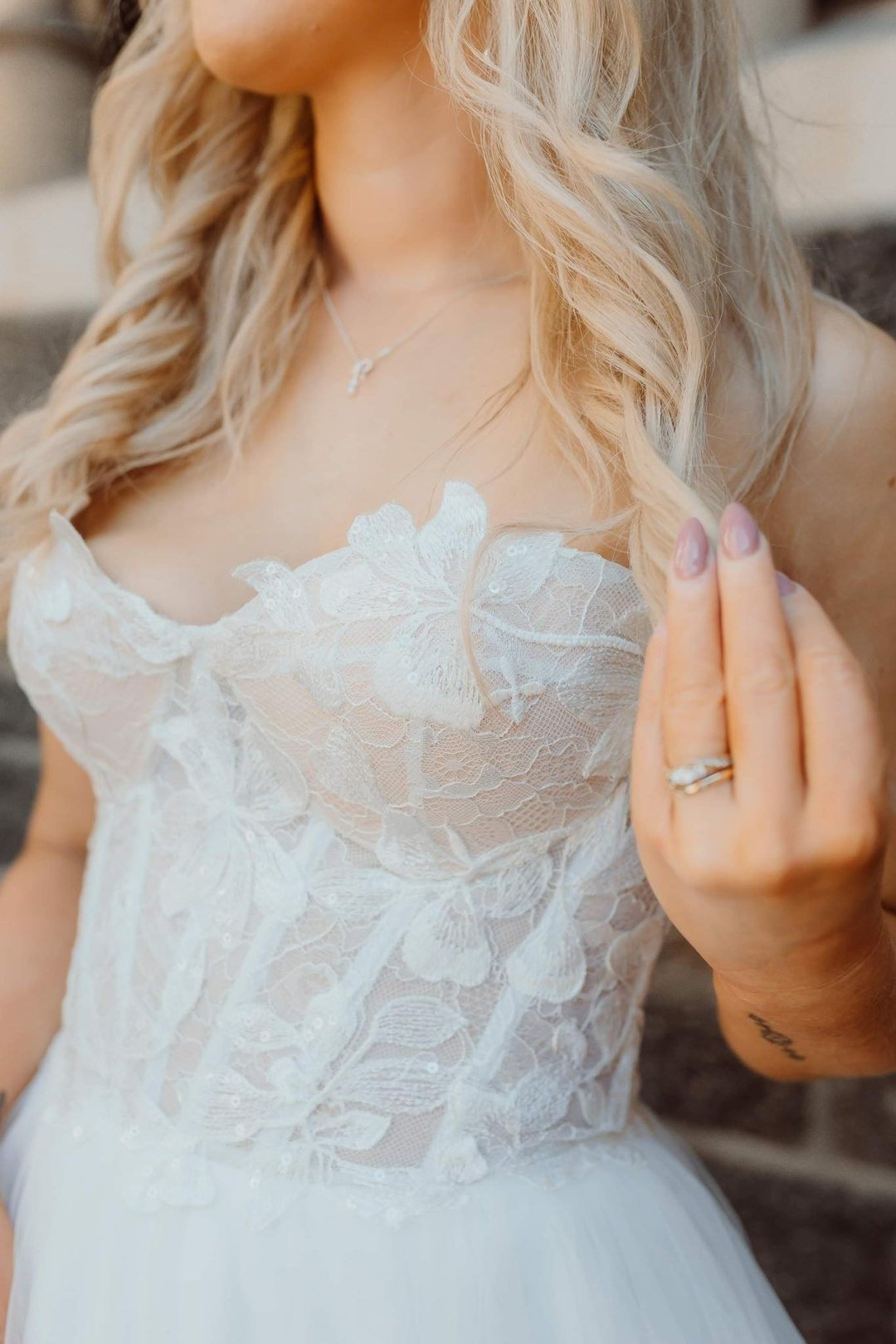 Close up and personal with the Mist gown. This stunner is a fully boned bustier with a chantilly lace and lace appliques on a full-gathered skirt. A dress that is fun and playful and will defiantly have your guest saying WOW!!!​​​​​​​​
​​​​​​​​
Photo