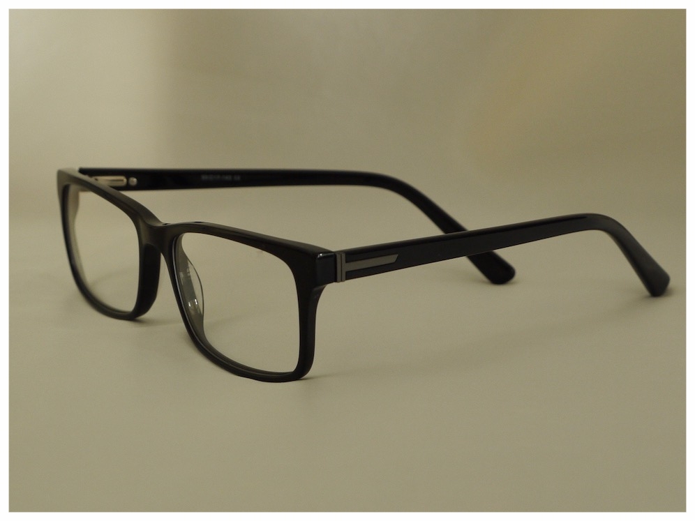 traditional black plastic spectacle frames with glass lenses