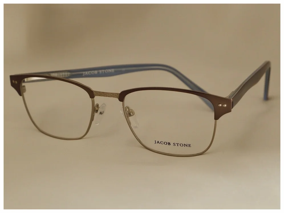 pair of elegant spectacles with brown metal front and brown/blue plastic temples